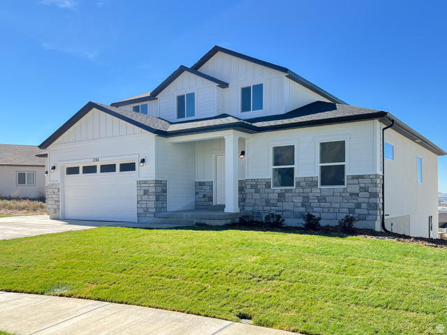 1510 West 600 North, Unit GE 04 Mapleton, UT 84664 - Photo 2 of 21 Contemporary residence featuring a two-car garage, white siding, and a stone facade