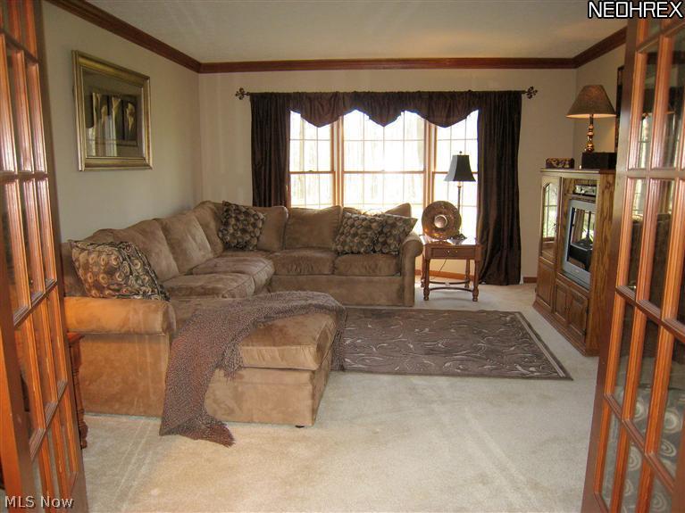 560 East Jackson Road Aurora, OH 44202 - Photo 4 of 25 Formal Living Rm w/Bay Window. Glass French Doors to Family Rm. Great Flow for Entertaining.