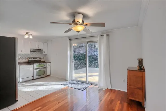 a kitchen with a stove a sink and a refrigerator