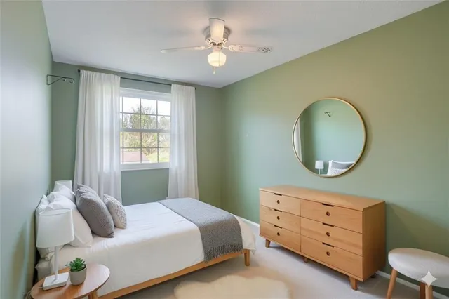 a bedroom with a bed and a dresser