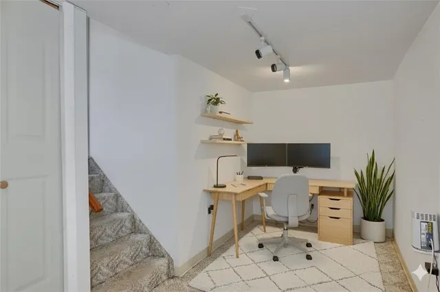a workspace with furniture and wooden floor