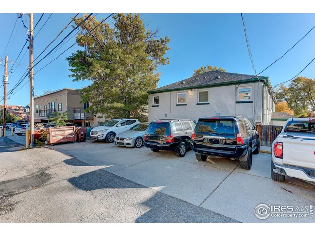 a view of a cars park in front of house