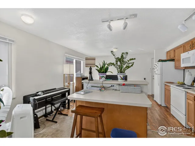 a kitchen with a table and chairs