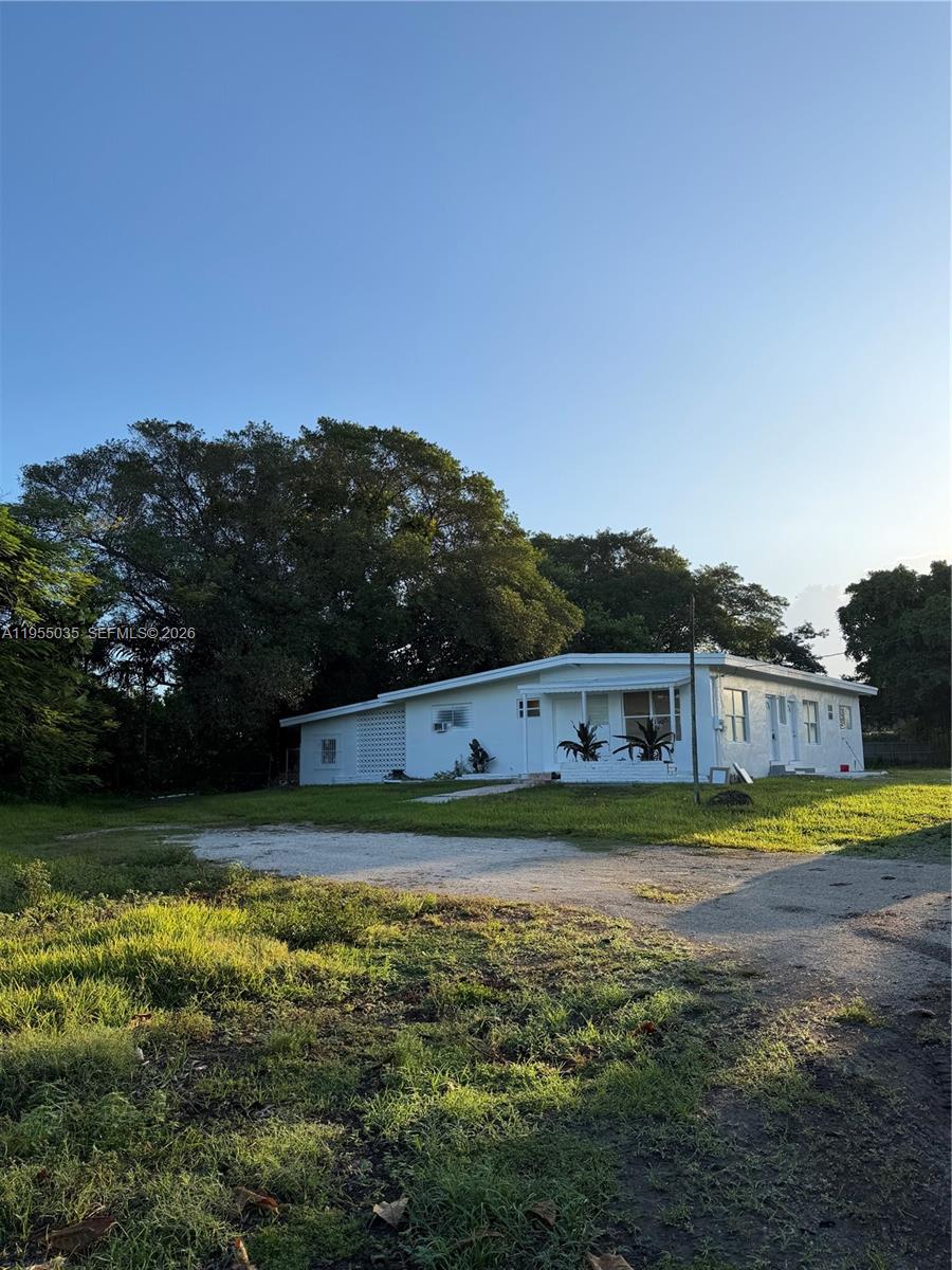 a view of a swimming pool with an outdoor seating and a lake view