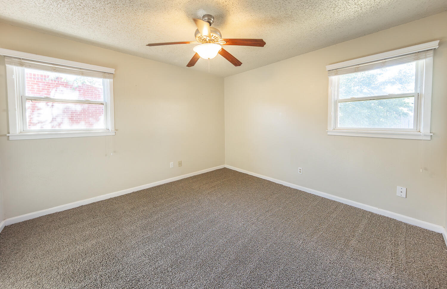 5017 46th Street Lubbock, TX 79414 - Photo 11 of 24 a view of an empty room with a window