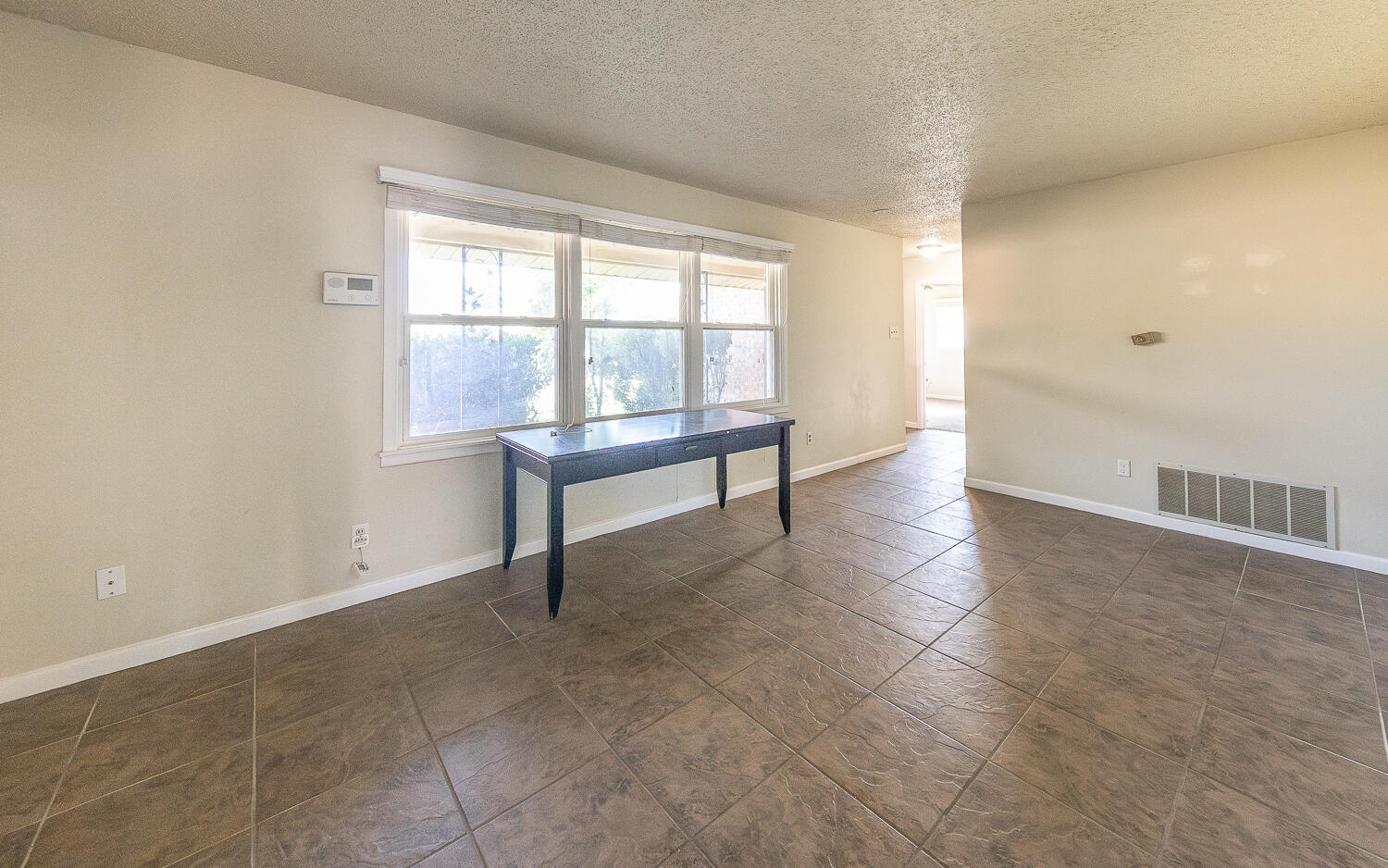 5017 46th Street Lubbock, TX 79414 - Photo 18 of 24 a view of an empty room with a window