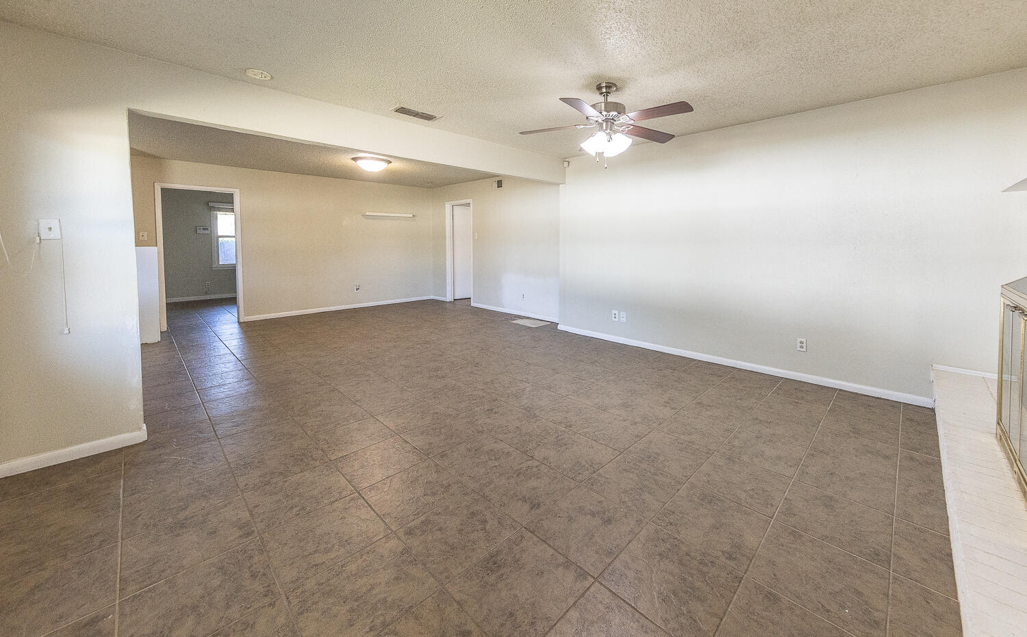 5017 46th Street Lubbock, TX 79414 - Photo 5 of 24 wooden floor in an empty room