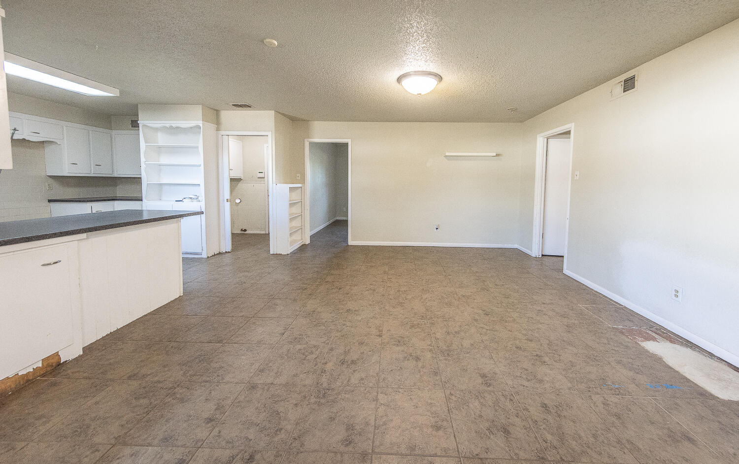 5017 46th Street Lubbock, TX 79414 - Photo 6 of 24 a view of a kitchen with a sink and cabinets