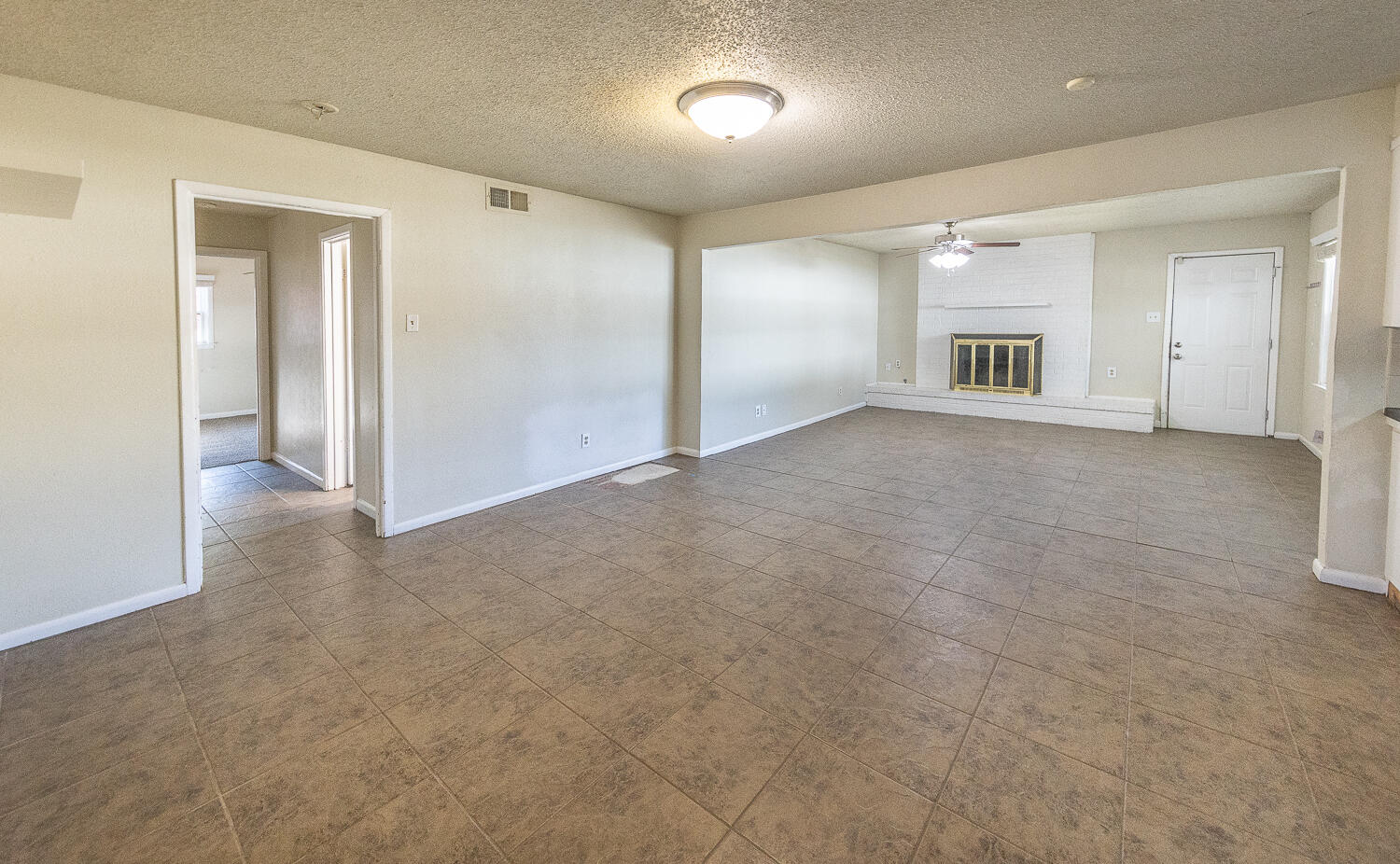 5017 46th Street Lubbock, TX 79414 - Photo 9 of 24 an empty room with windows and cabinet
