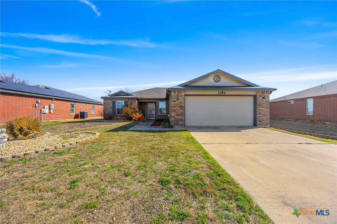 3208 Viewcrest Drive Killeen, TX 76549 - Photo 1 of 15 a front view of a house with a yard