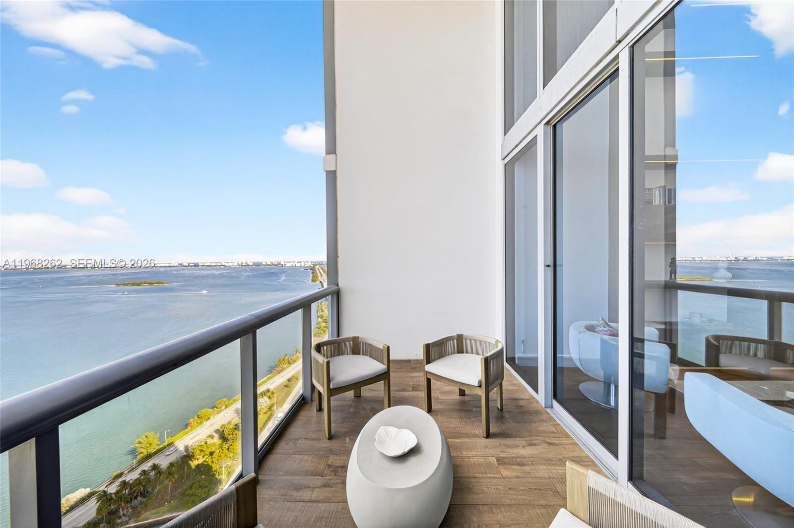 601 Northeast 36th Street, Unit 3407 Miami, FL 33137 - Photo 14 of 41 a view of a balcony with chairs