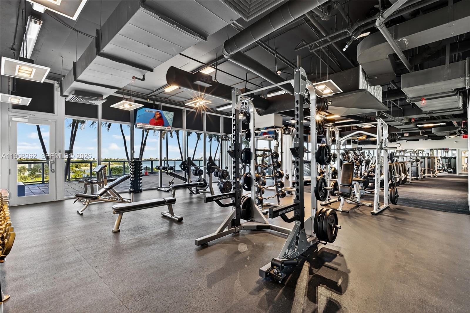 601 Northeast 36th Street, Unit 3407 Miami, FL 33137 - Photo 34 of 41 a view of a room with gym equipment