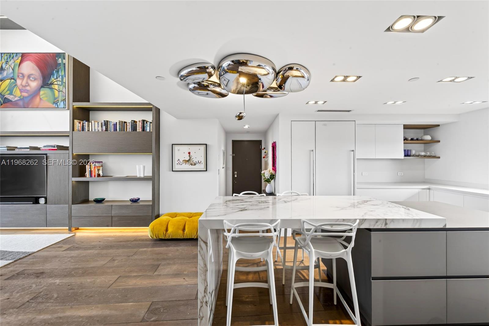 601 Northeast 36th Street, Unit 3407 Miami, FL 33137 - Photo 7 of 41 a kitchen with stainless steel appliances kitchen island granite countertop a stove a sink and a refrigerator