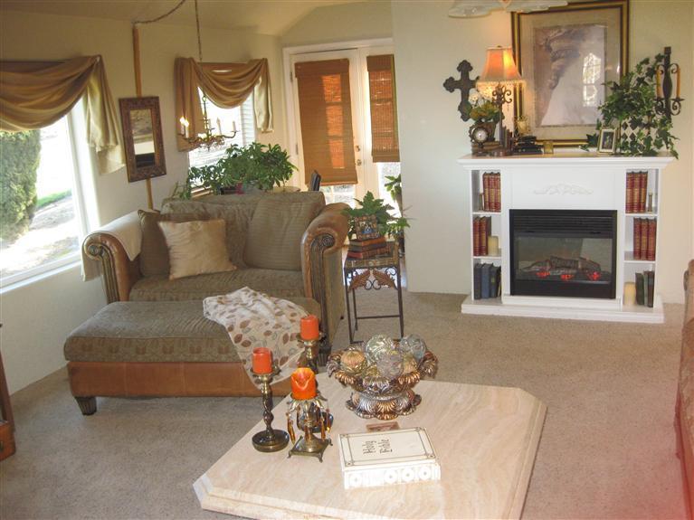 3155 Old Stage Road Central Point, OR 97502 - Photo 16 of 24 a living room with furniture and a fireplace
