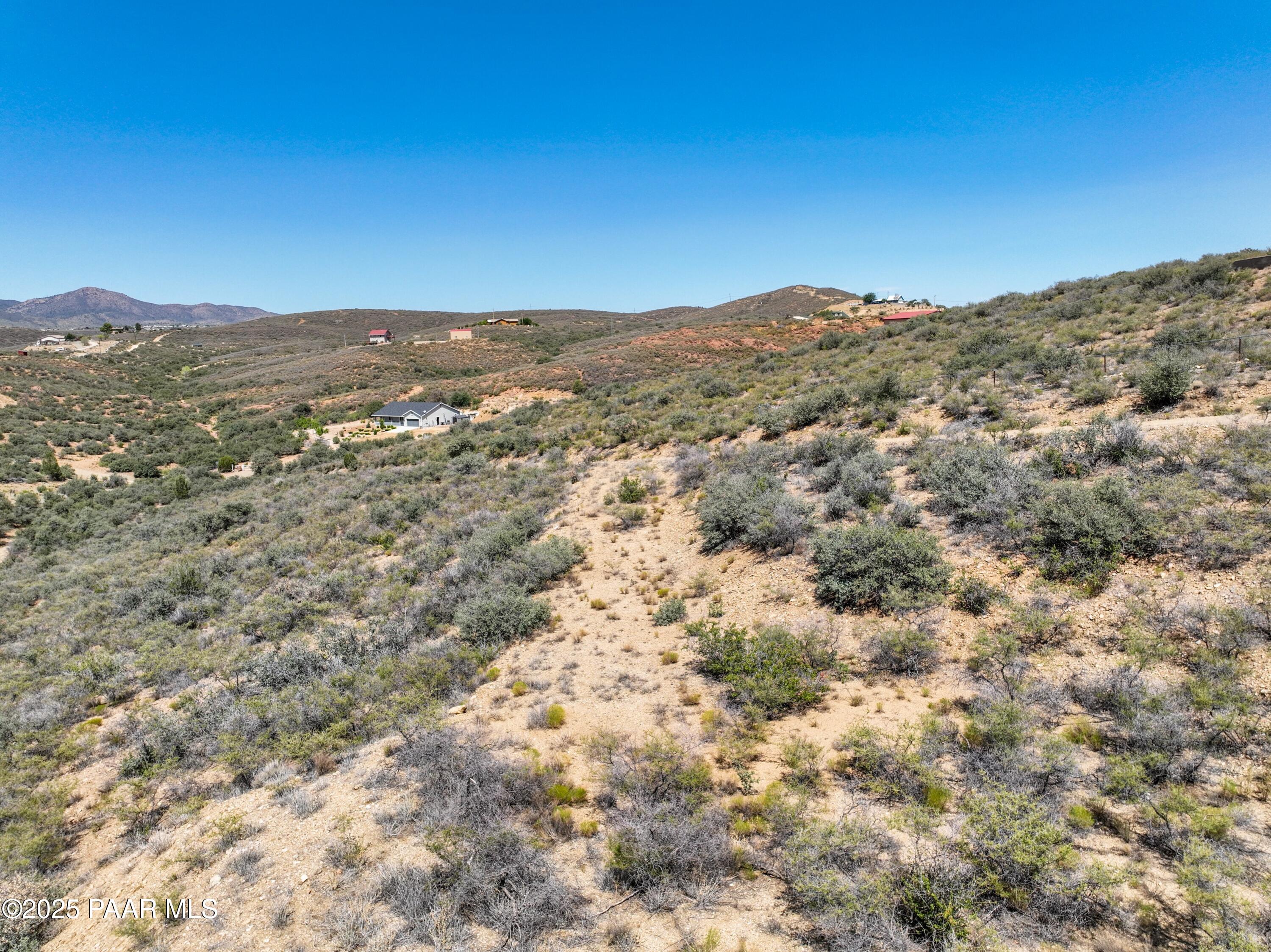 1285 South Stumps Road Dewey-Humboldt, AZ 86327 - Photo 12 of 21 a view of a mountain range with trees in the background