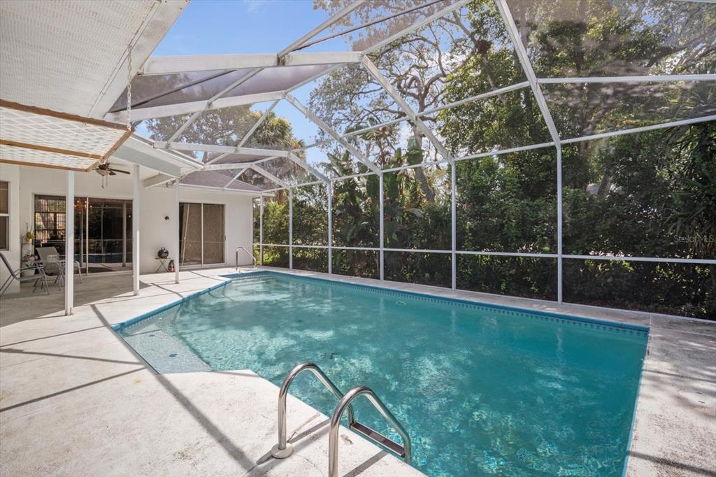 7282 Aloe Drive Spring Hill, FL 34607 - Photo 19 of 25 a view of a backyard with a garden and deck