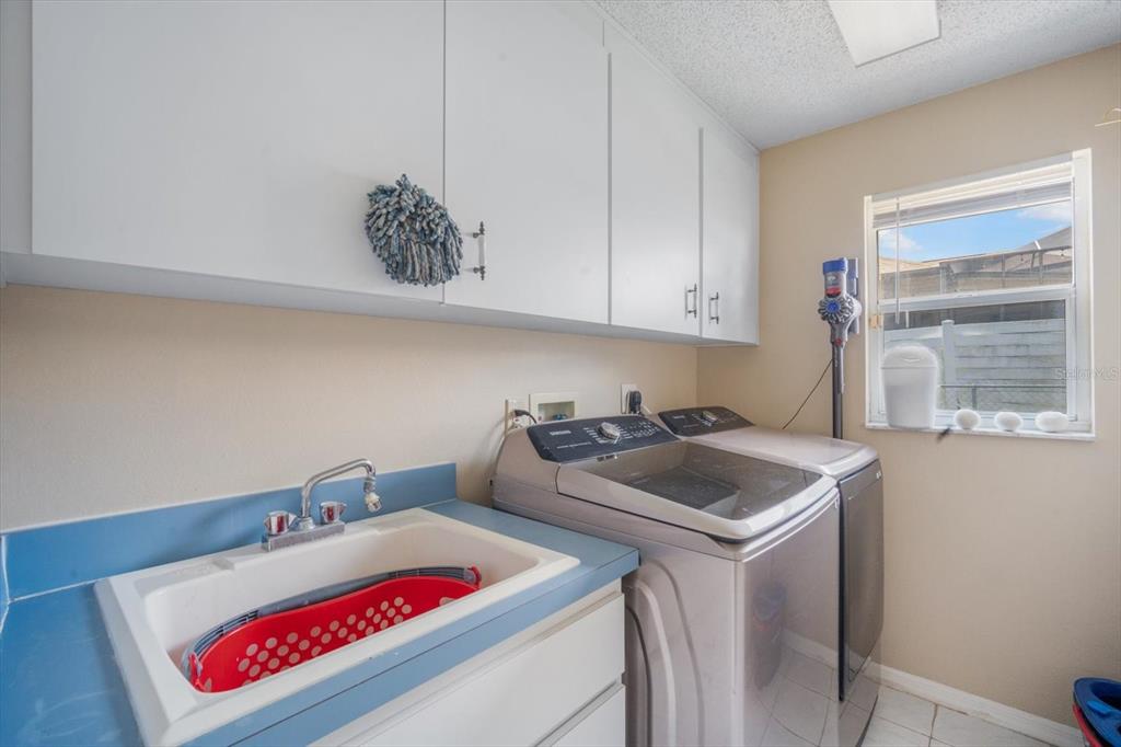 7282 Aloe Drive Spring Hill, FL 34607 - Photo 21 of 25 a utility room with dryer and washer