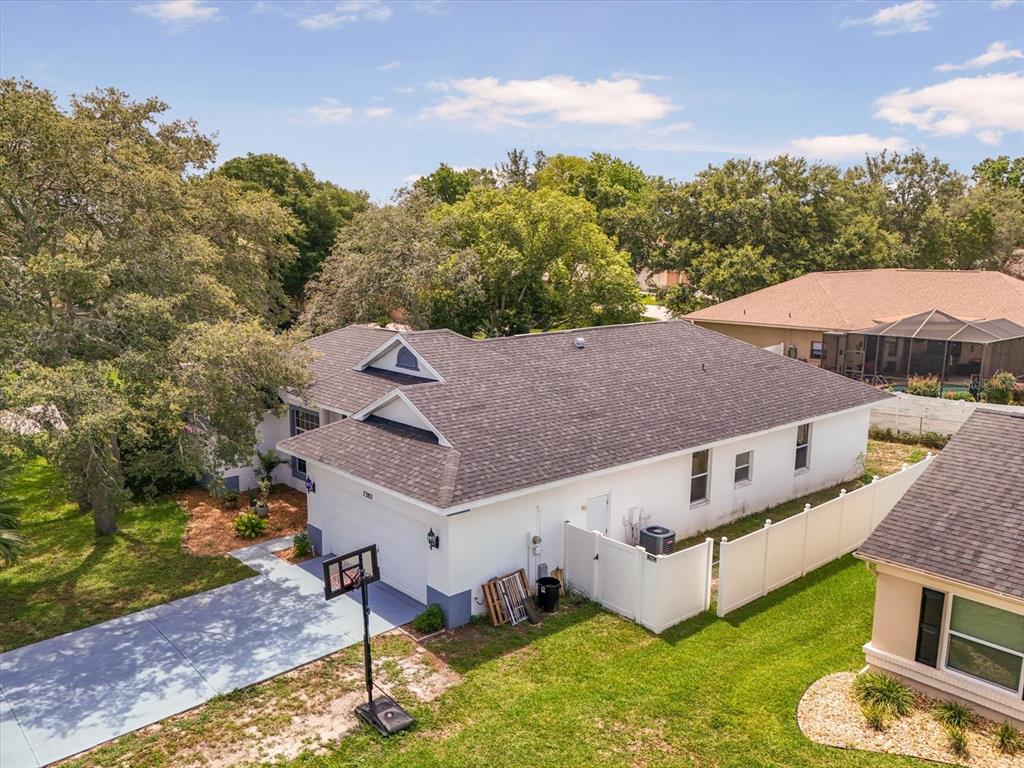 7282 Aloe Drive Spring Hill, FL 34607 - Photo 22 of 25 an aerial view of a house with a big yard