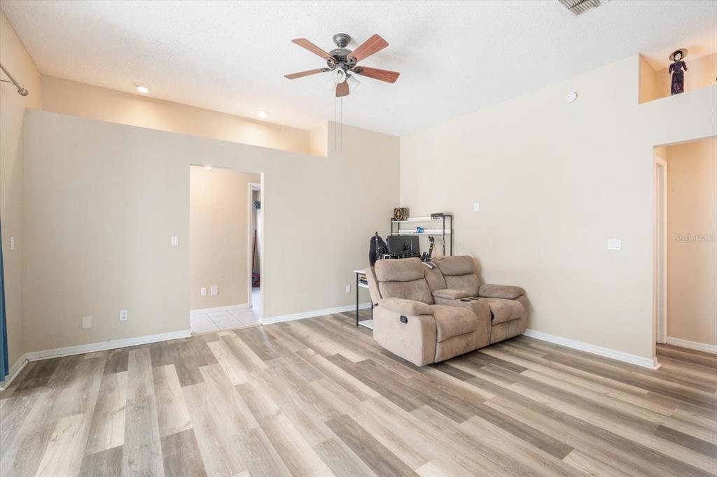 7282 Aloe Drive Spring Hill, FL 34607 - Photo 8 of 25 a living room with furniture