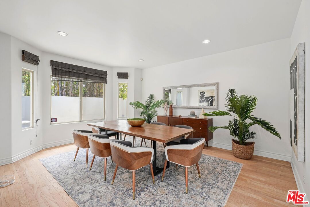 1991 Stradella Road Los Angeles, CA 90077 - Photo 12 of 26 a dining room with furniture and wooden floor