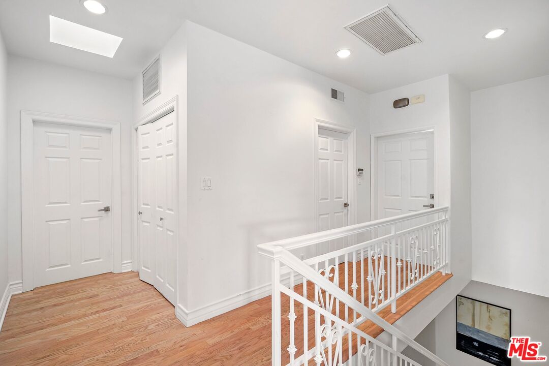 1991 Stradella Road Los Angeles, CA 90077 - Photo 13 of 26 a view of an entryway with wooden floor
