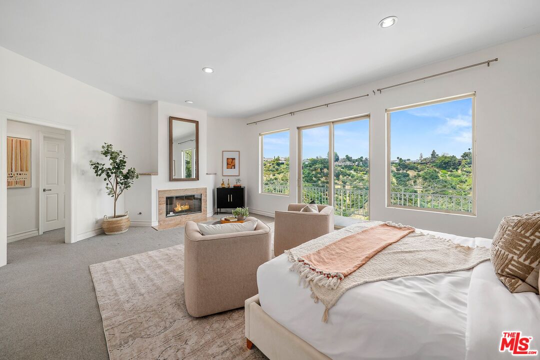 1991 Stradella Road Los Angeles, CA 90077 - Photo 14 of 26 a bed room with a bed and a couch