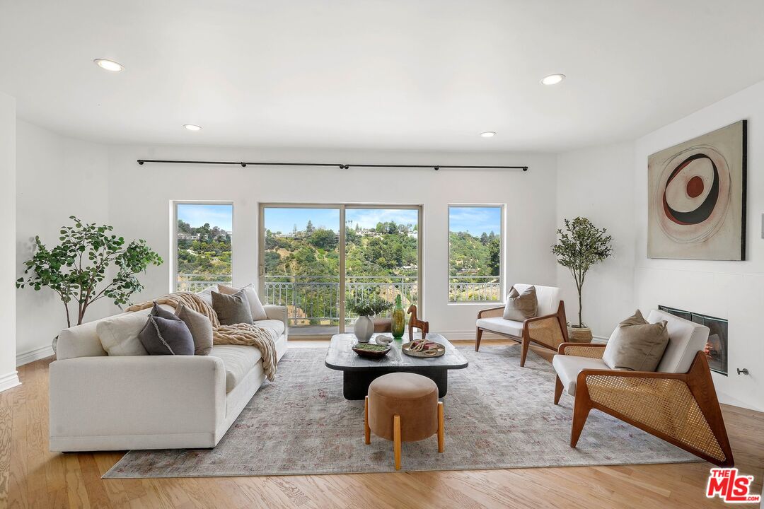 1991 Stradella Road Los Angeles, CA 90077 - Photo 6 of 26 a living room with furniture and a large window