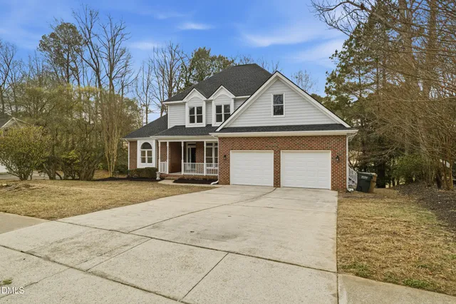 a kitchen with granite countertop white cabinets and stainless steel appliances