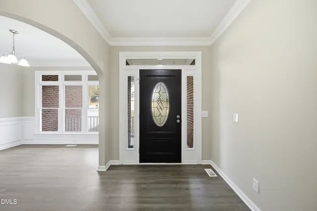 a bathroom with a granite countertop sink mirror vanity and toilet