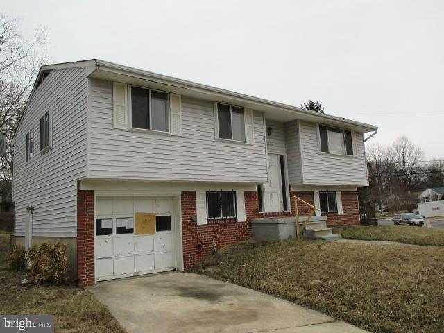8800 Sigrid Road Randallstown, MD 21133 - Photo 1 of 16 a front view of a house with a yard