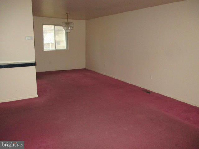 8800 Sigrid Road Randallstown, MD 21133 - Photo 4 of 16 an empty room with a window