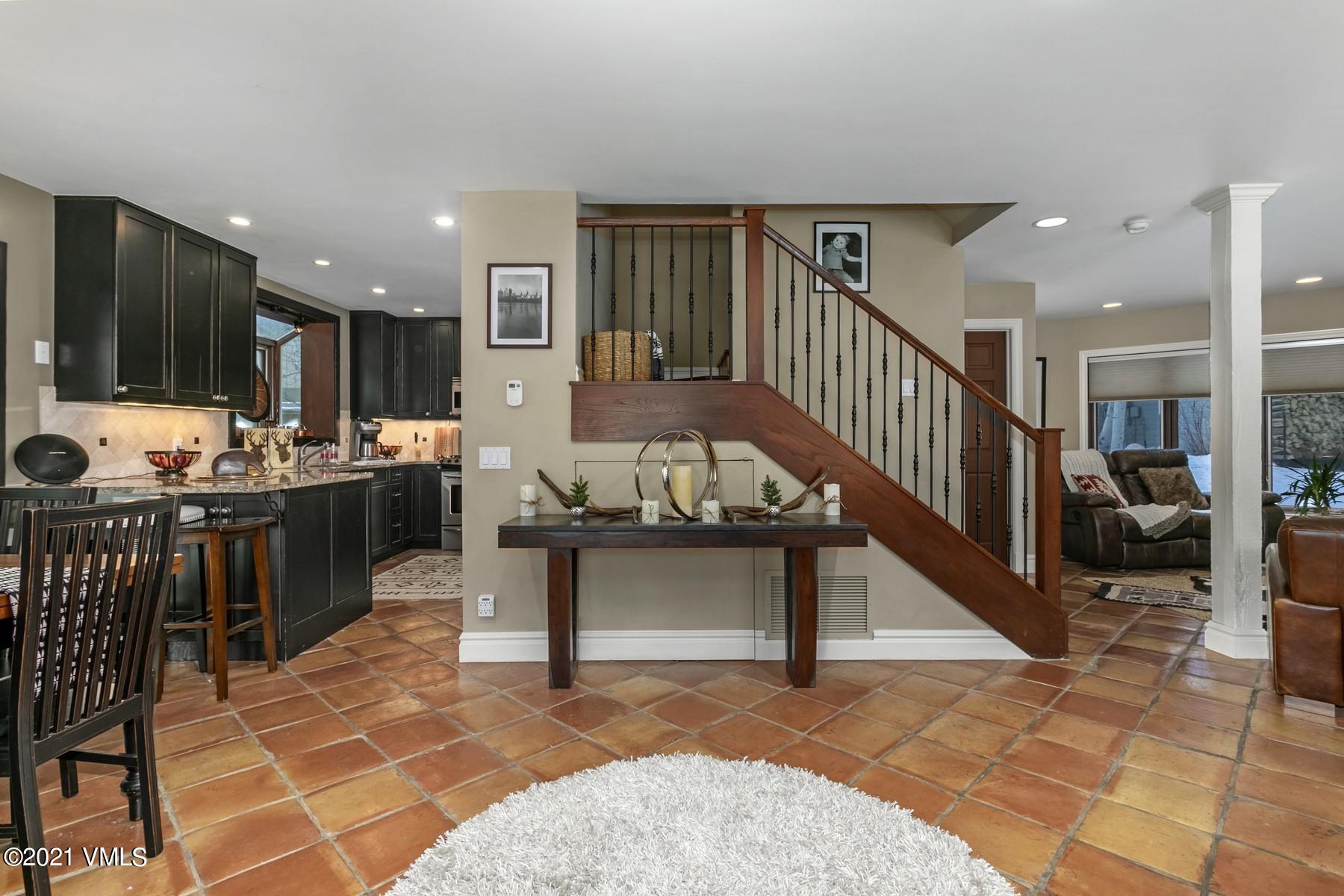 3000 Eaglebend Drive, Unit 1 Avon, CO 81620 - Photo 9 of 41 a view of kitchen with furniture and outdoor living room