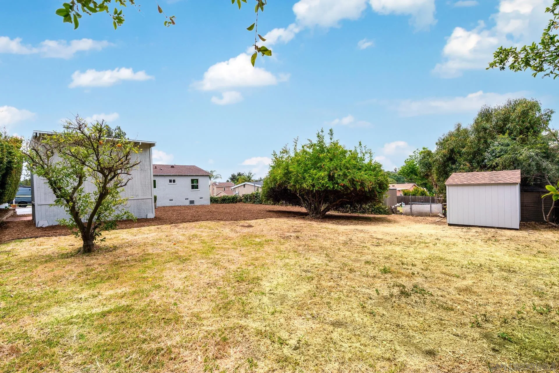 a swimming pool with an outdoor space and seating