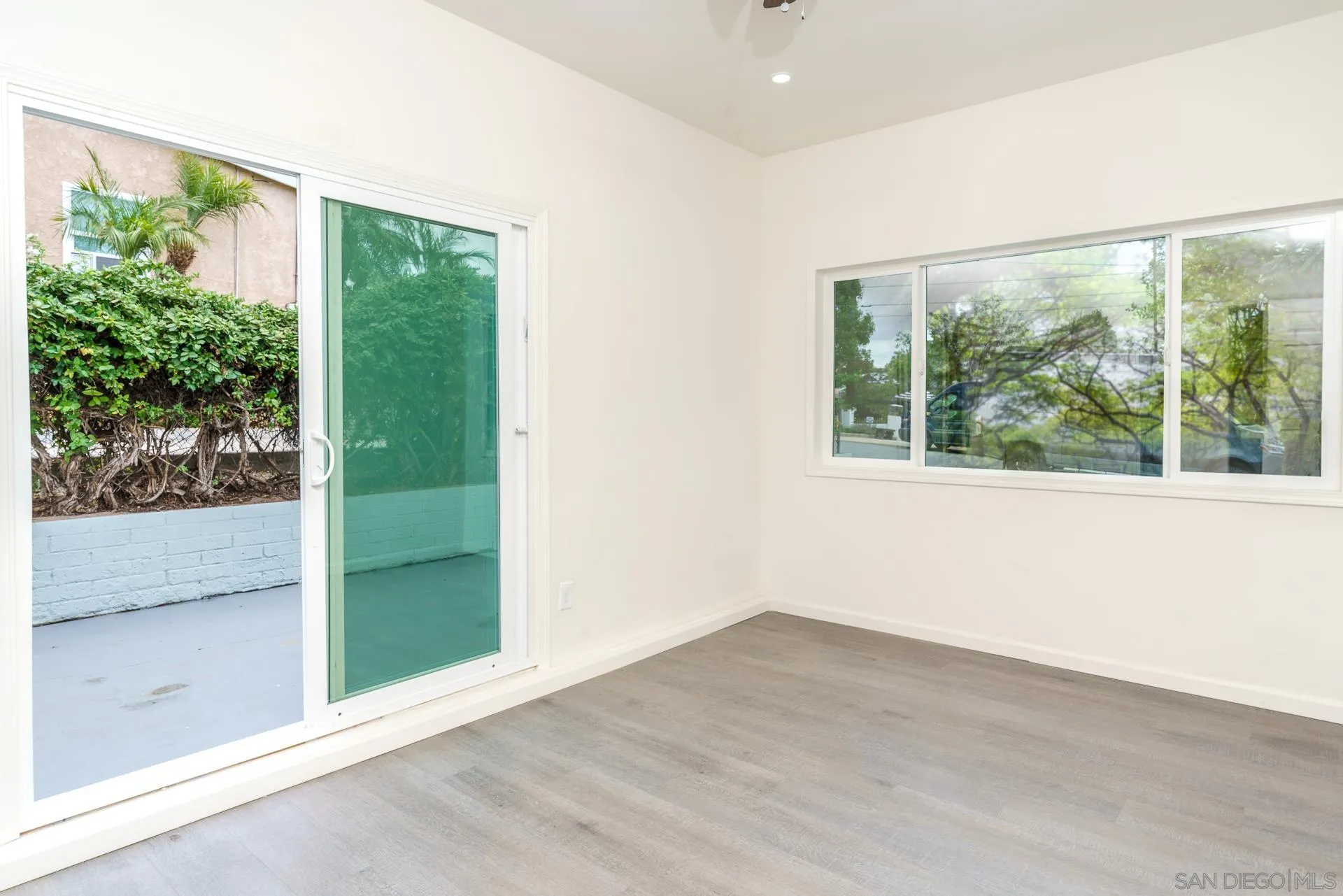 9208 Brookside Circle Spring Valley, CA 91977 - Photo 13 of 31 an empty room with wooden floor and outdoor view