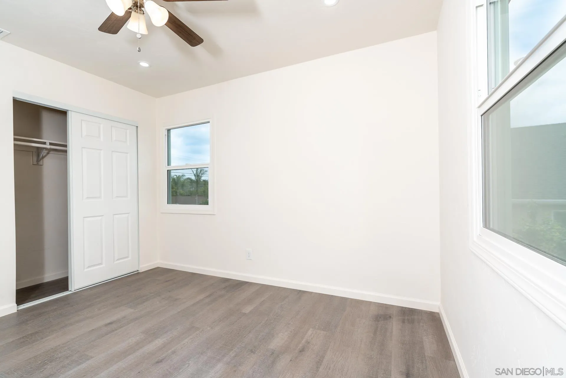 9208 Brookside Circle Spring Valley, CA 91977 - Photo 21 of 31 a view of an empty room with wooden floor and a window