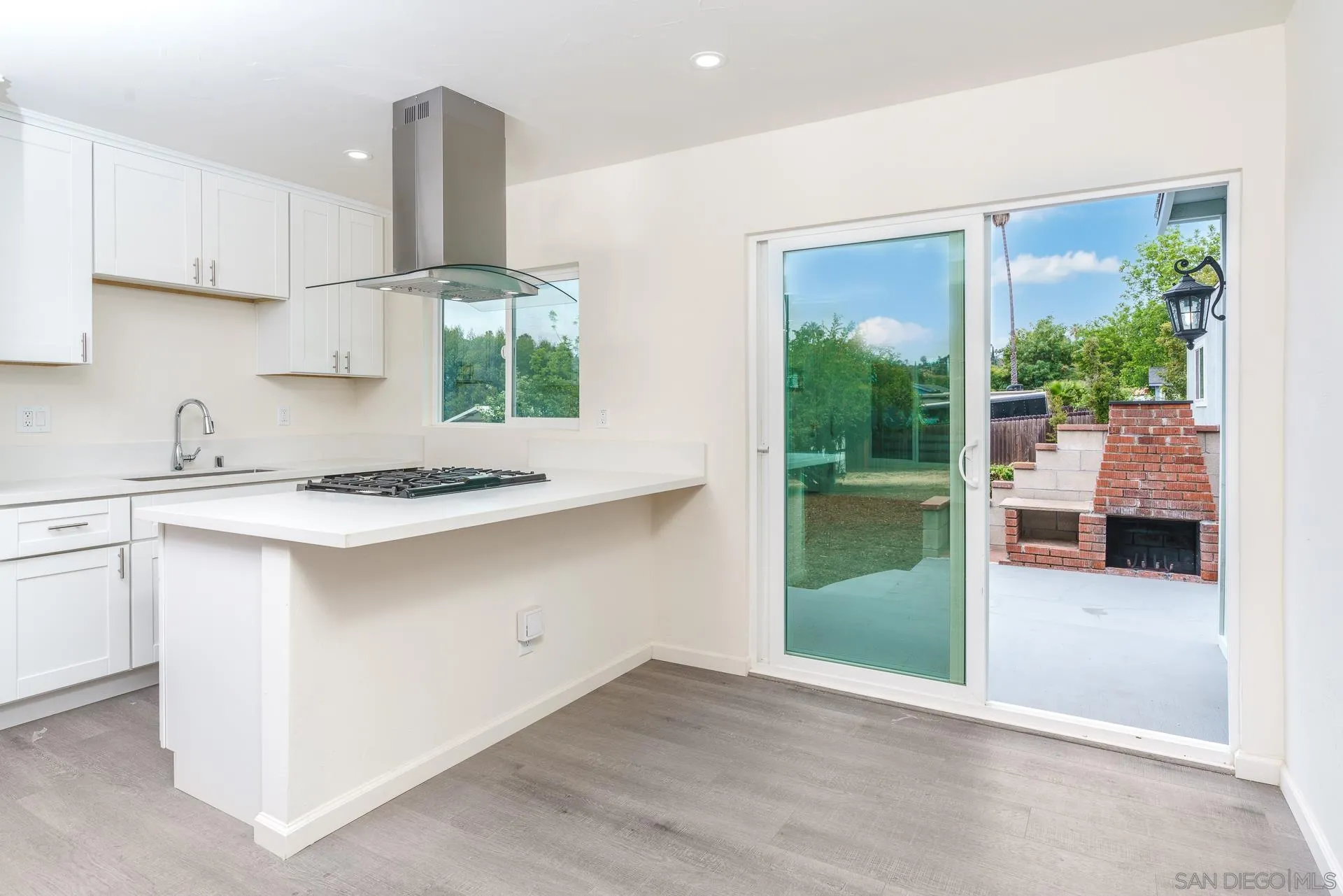 9208 Brookside Circle Spring Valley, CA 91977 - Photo 6 of 31 a kitchen with a window a sink and a counter top space