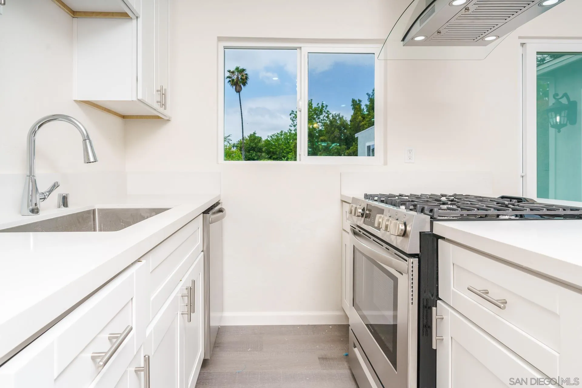9208 Brookside Circle Spring Valley, CA 91977 - Photo 7 of 31 a kitchen with granite countertop a sink and a stove