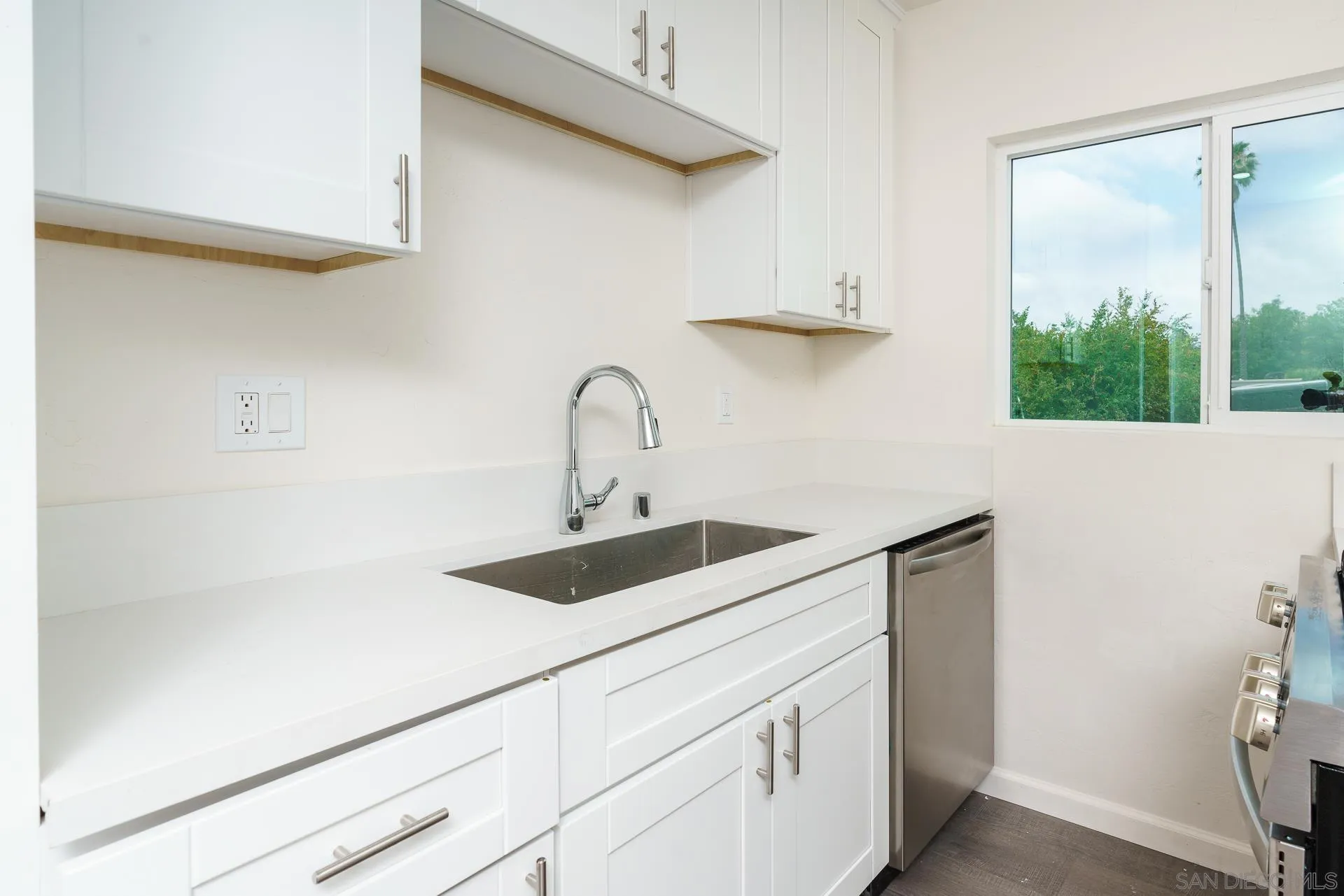 9208 Brookside Circle Spring Valley, CA 91977 - Photo 8 of 31 a kitchen with a sink and cabinets