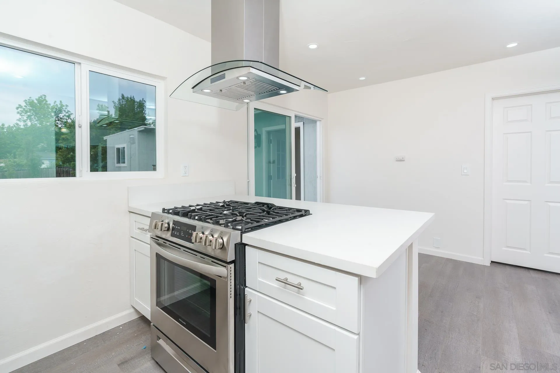 9208 Brookside Circle Spring Valley, CA 91977 - Photo 9 of 31 a stove top oven sitting inside of a kitchen