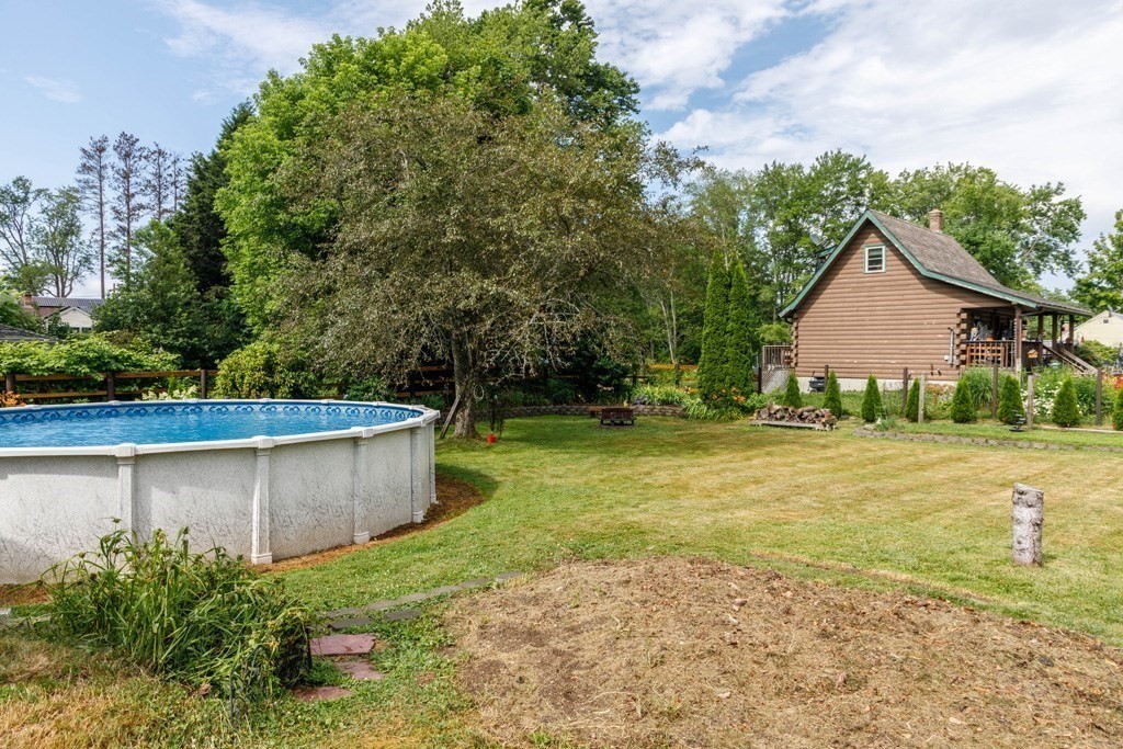 75 East Myrtle Street Orange, MA 01364 - Photo 17 of 28 a view of a backyard with large trees