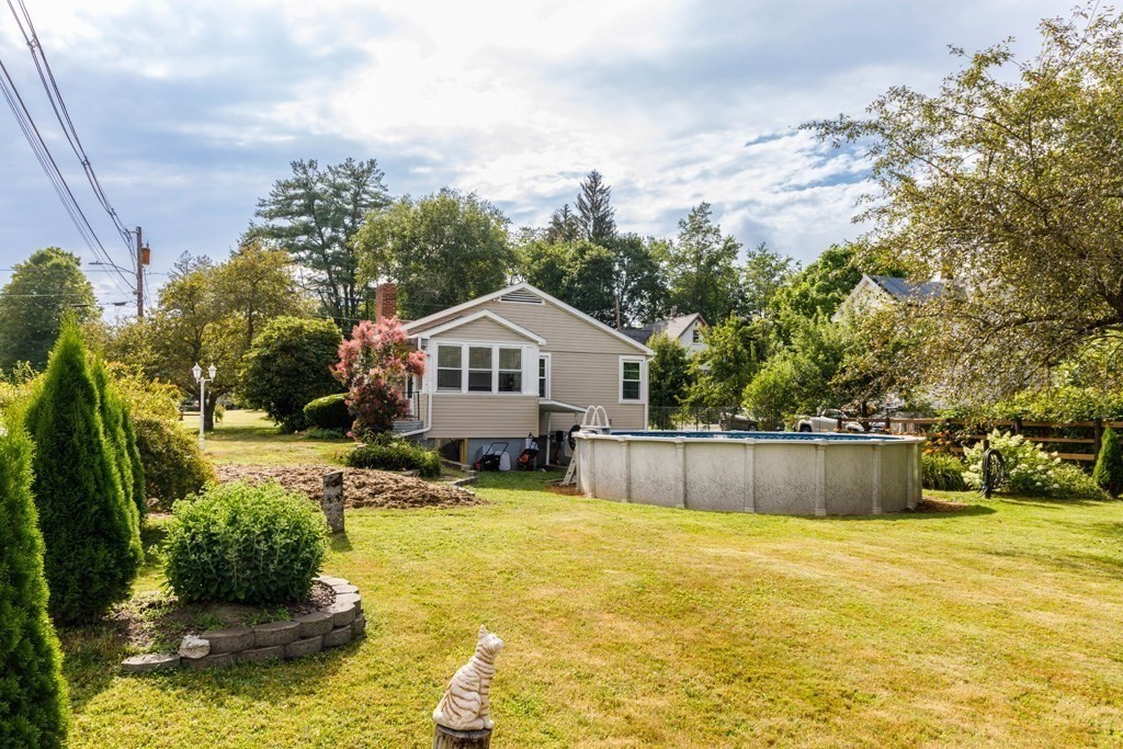 75 East Myrtle Street Orange, MA 01364 - Photo 19 of 28 a swimming pool with outdoor seating and yard