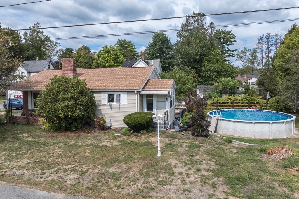 75 East Myrtle Street Orange, MA 01364 - Photo 25 of 28 a view of a house with a yard and sitting area