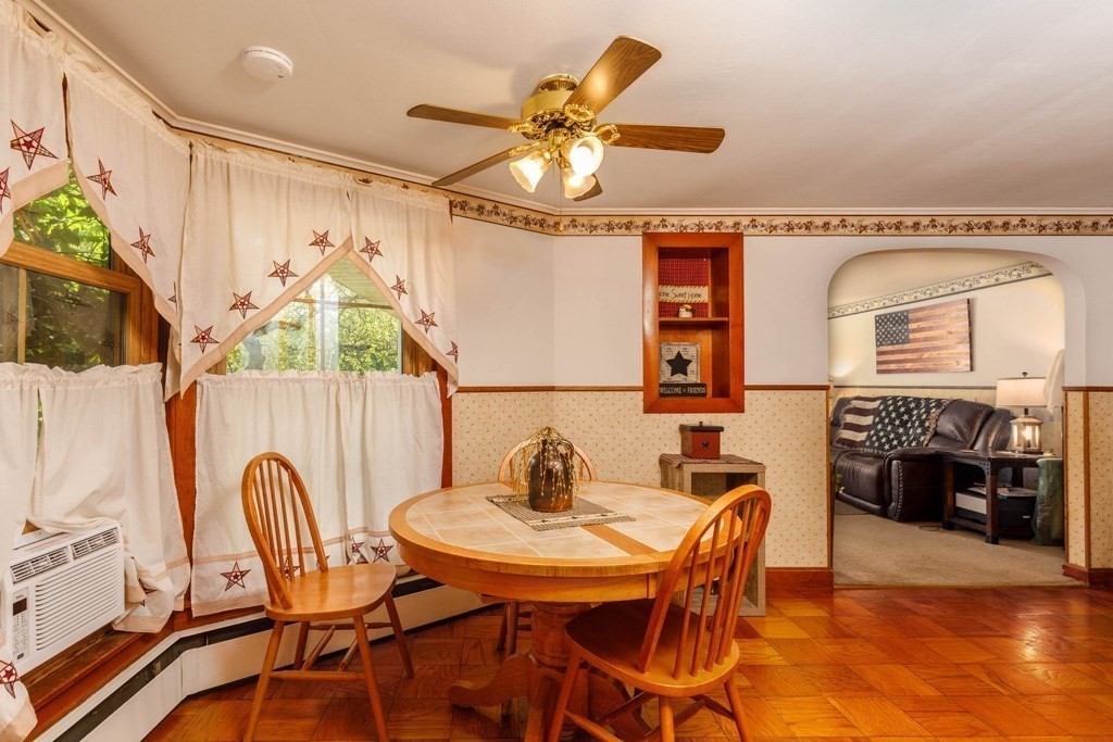 75 East Myrtle Street Orange, MA 01364 - Photo 4 of 28 a view of a dining room with furniture and chandelier