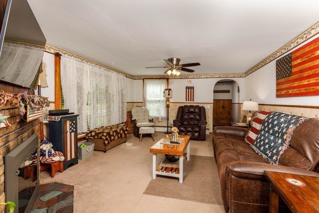 75 East Myrtle Street Orange, MA 01364 - Photo 6 of 28 a living room with furniture a couch and large window