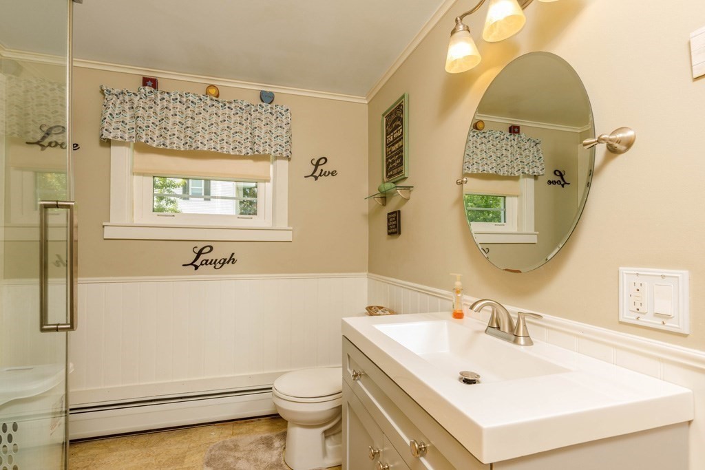 75 East Myrtle Street Orange, MA 01364 - Photo 8 of 28 a bathroom with a sink mirror vanity and toilet