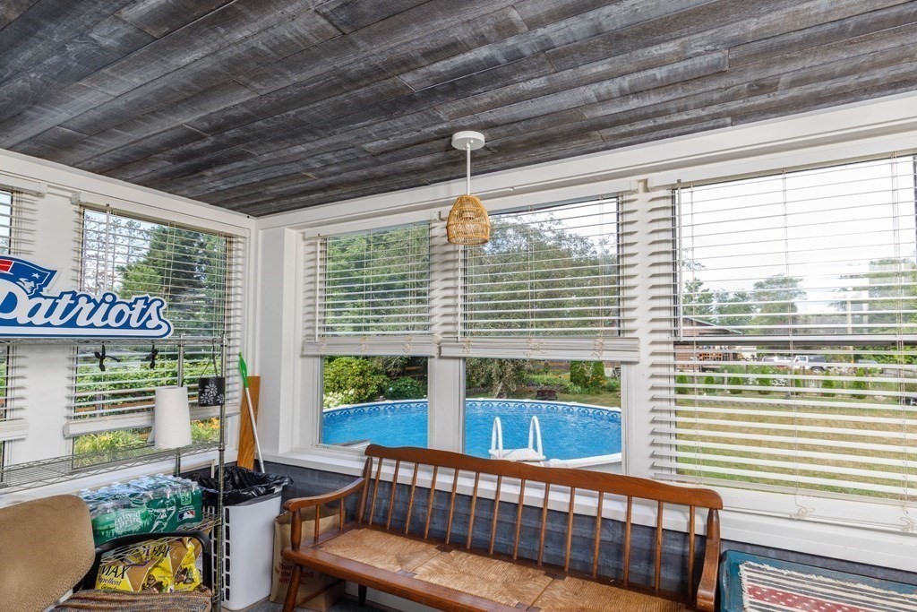 75 East Myrtle Street Orange, MA 01364 - Photo 10 of 28 a view of a porch with furniture and a yard