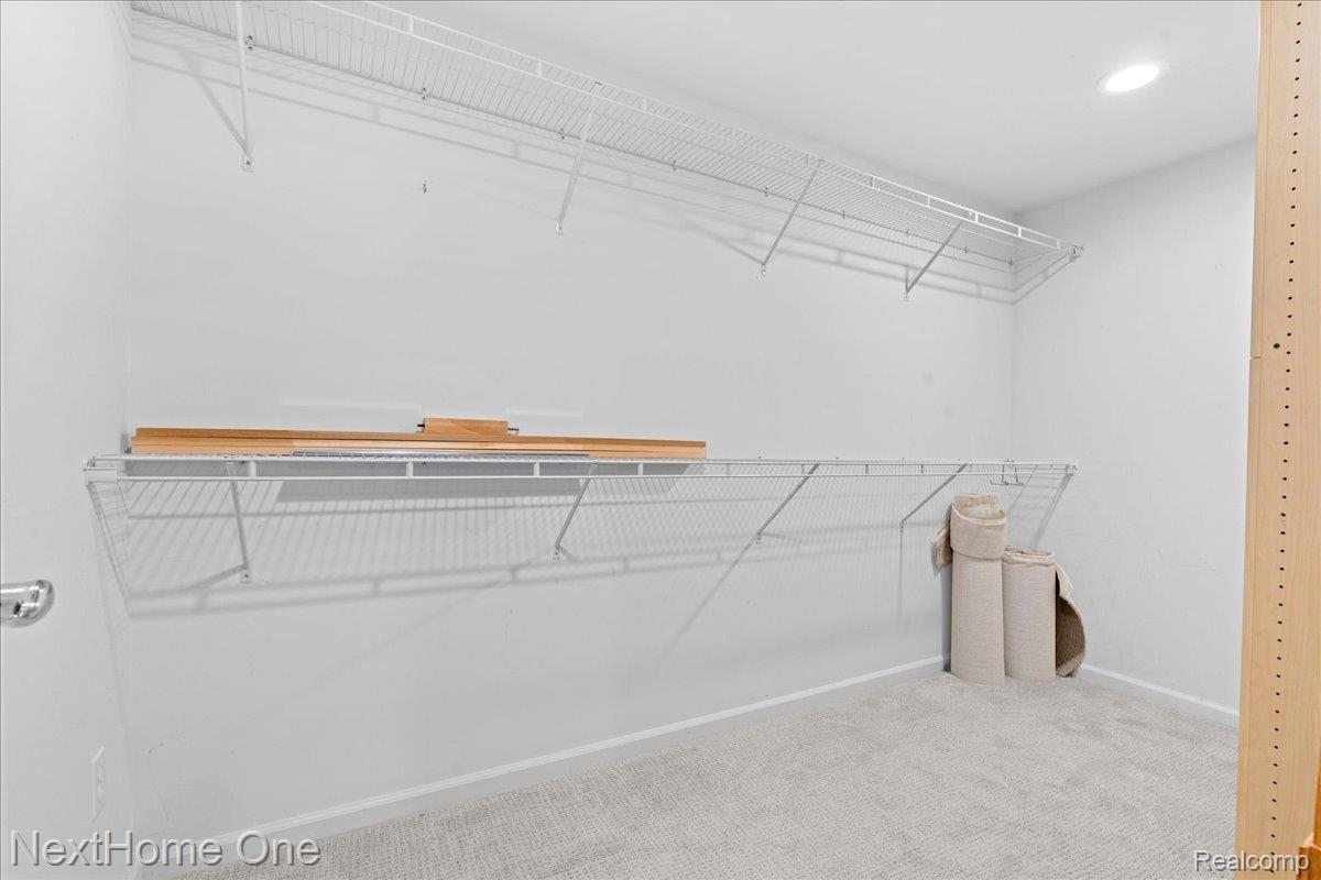 10083 Ridge Run Street, Unit 24 Howell, MI 48855 - Photo 21 of 27 Oversized basement bedroom closet