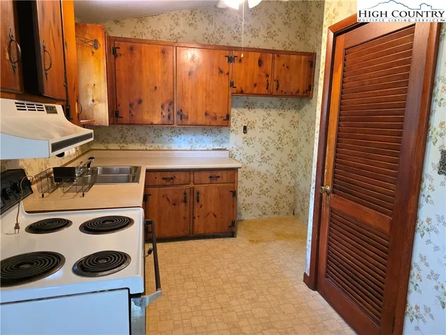 a bathroom with a sink and a washing machine