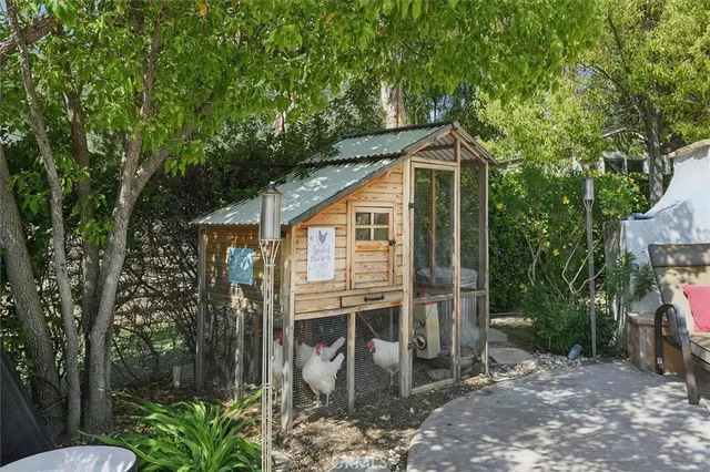 a view of a backyard with sitting area