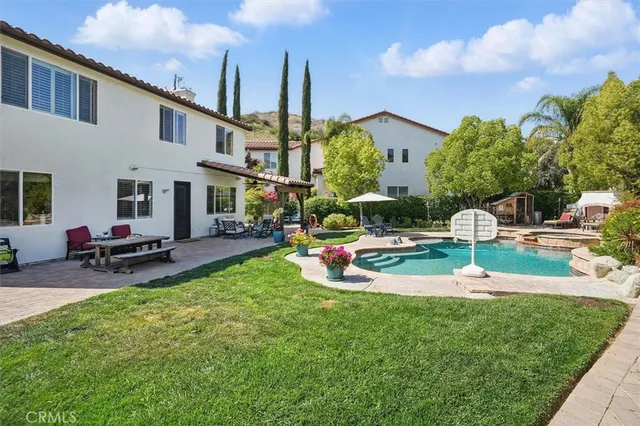 a view of a patio with a table and chairs
